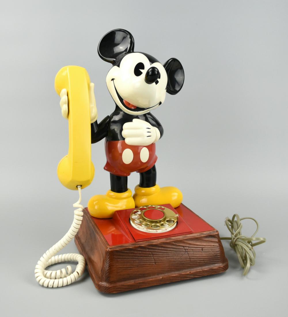 1976 Mickey Mouse Rotary Dial Phone: Vintage Mickey Mouse dial phone by America Telecommunications Corp. For more than 30 years, this stylized phone has been a favorite of all ages. H: 14 3/4"(37cm) D: 8 1/4"(21cm) Condition: In excellen