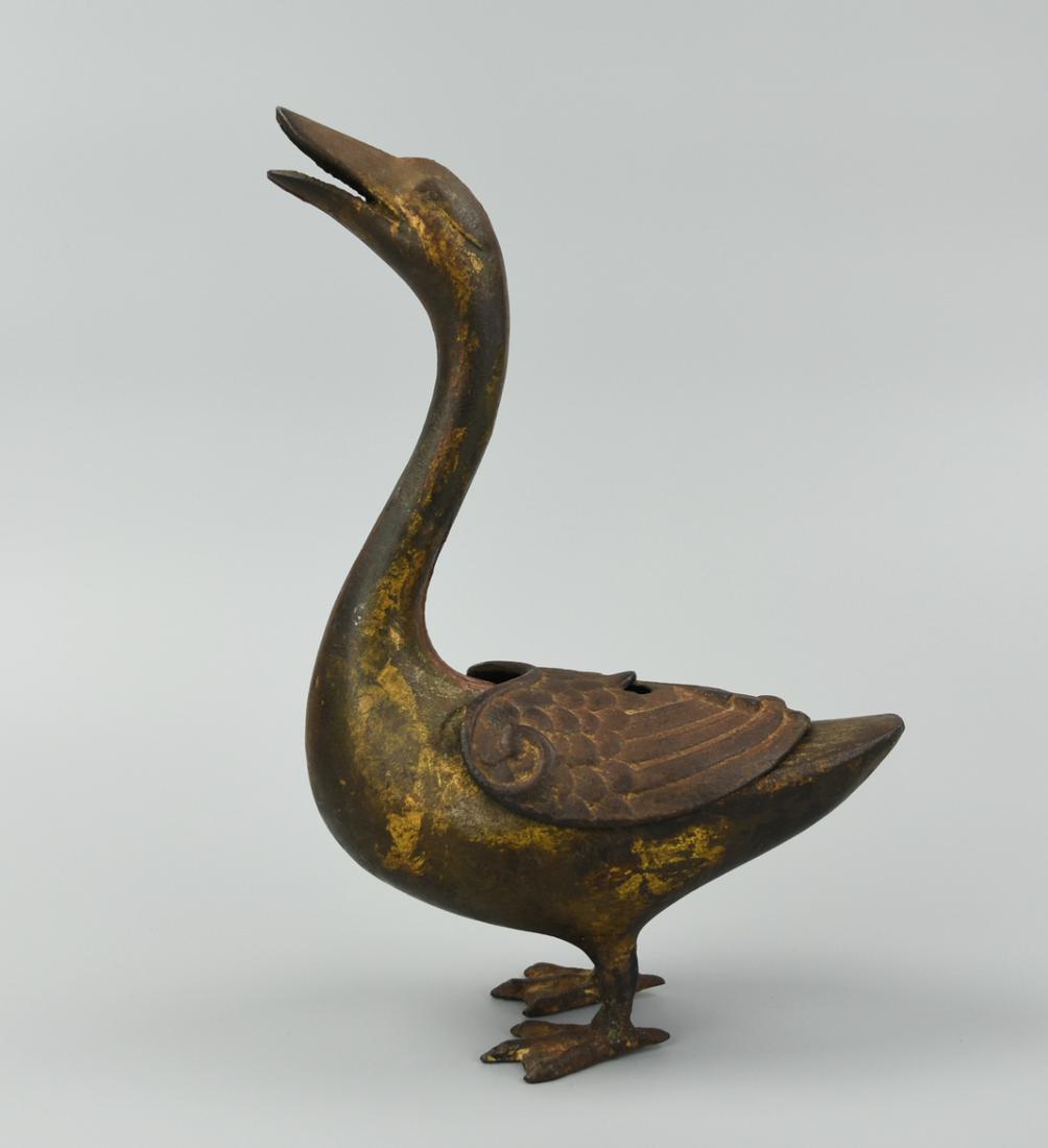 Chinese Bronze Goose Censer, 17th C.: An 17th C,unusual, Chinese, bronze censer in the shape of a goose, its head raised with mouth agape to allow incense to vent through, the cover wing-shaped & removable to allow for changing & cleaning