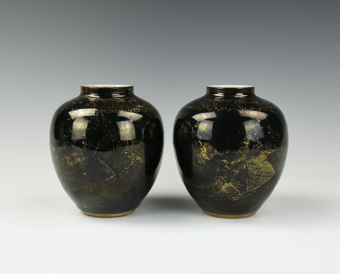 Pair of Chinese Gilt Black Glazed Jar ,19th C.: Of ovoid form, the well rounded sides rising to a short neck set with a flange below the lipped rim, the body painted in gold tones with fisherman on a boat all against a glossy black glaze, stopping 