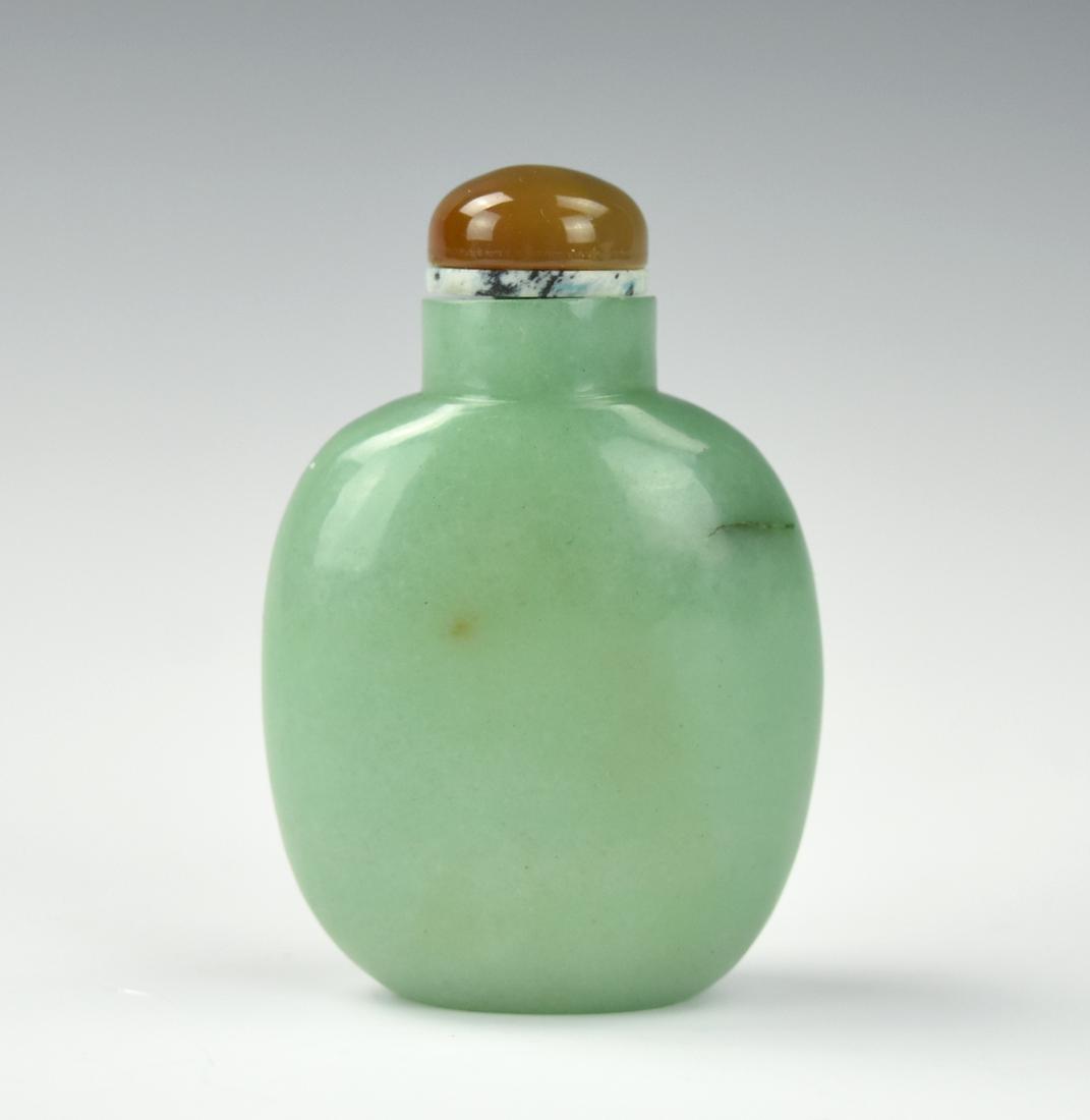 Chinese Jadeite Sunff Bottle ,Qing D.: Chinese ,Qing D, Green jadeite snuff bottle in oval shape,with flat foot, cap made of agate H:2 3/4" (7 cm) Condition: in good condition