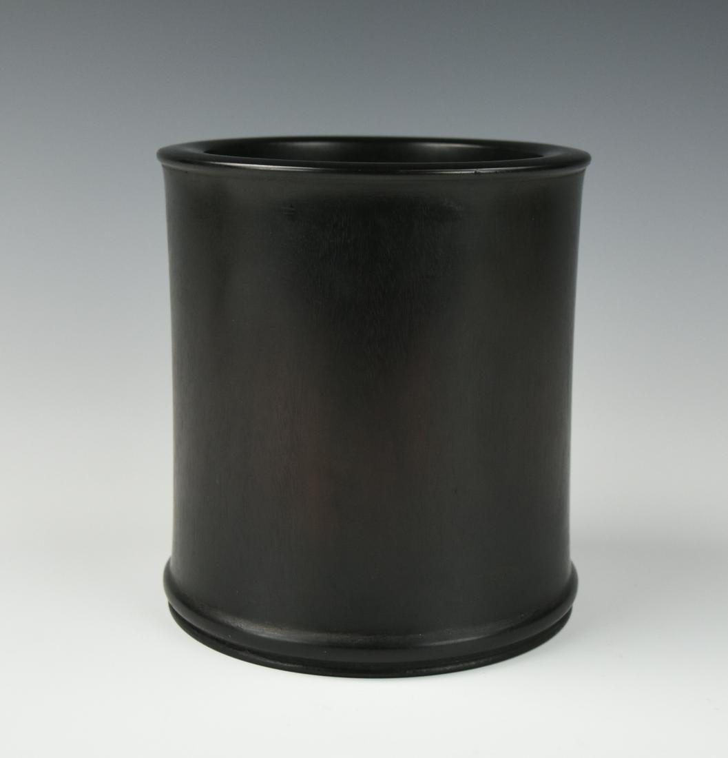 Fine Chinese Zitan Brushpot, Qing Dynasty: A Chinese, wood, Zitan brushpot, elegantly carved with a cylindrical body and everted mouthrim, a rounded raised rib bordering the foot, the densely grained wood of a dark reddish-brown colour with ch