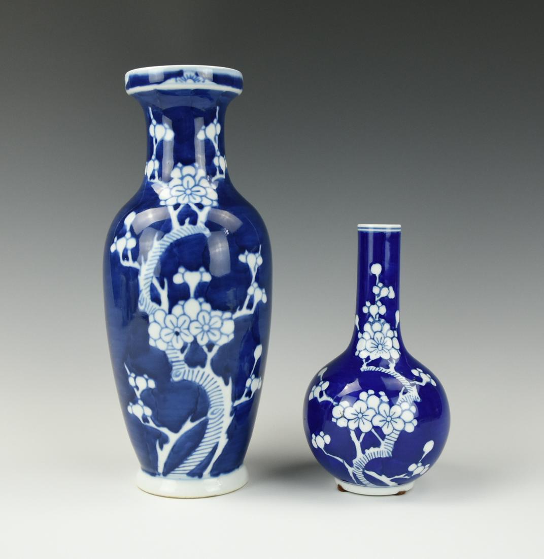 Two Chinese Blue & White Bottle Vase,20th C.: Decorated with branches of prunus blossom against a 'cracked-ice' ground Waisted neck with everted rim, painted in underglaze-blue with sprays of peony with a glazed, countersunk base H: 10 3/16"(25.9