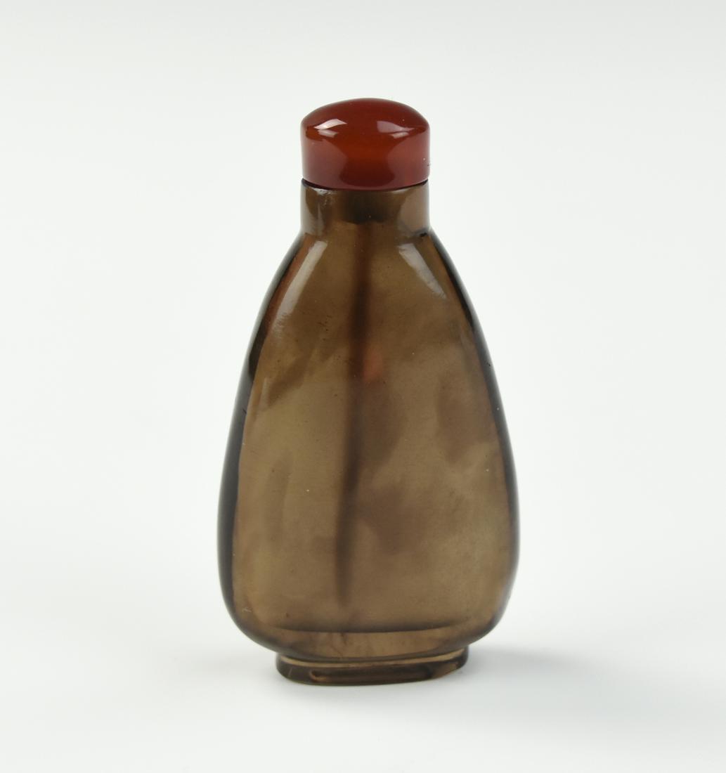 Chinese Glass Snuff Bottle, Qing Dynasty: Chinese ,late Qing Dynasty, triangular shaped dark brown glass snuff bottle with cinnamon colored glass cover H: 2.7/8"(7cm) Condition: In excellent condition with no signs of damage