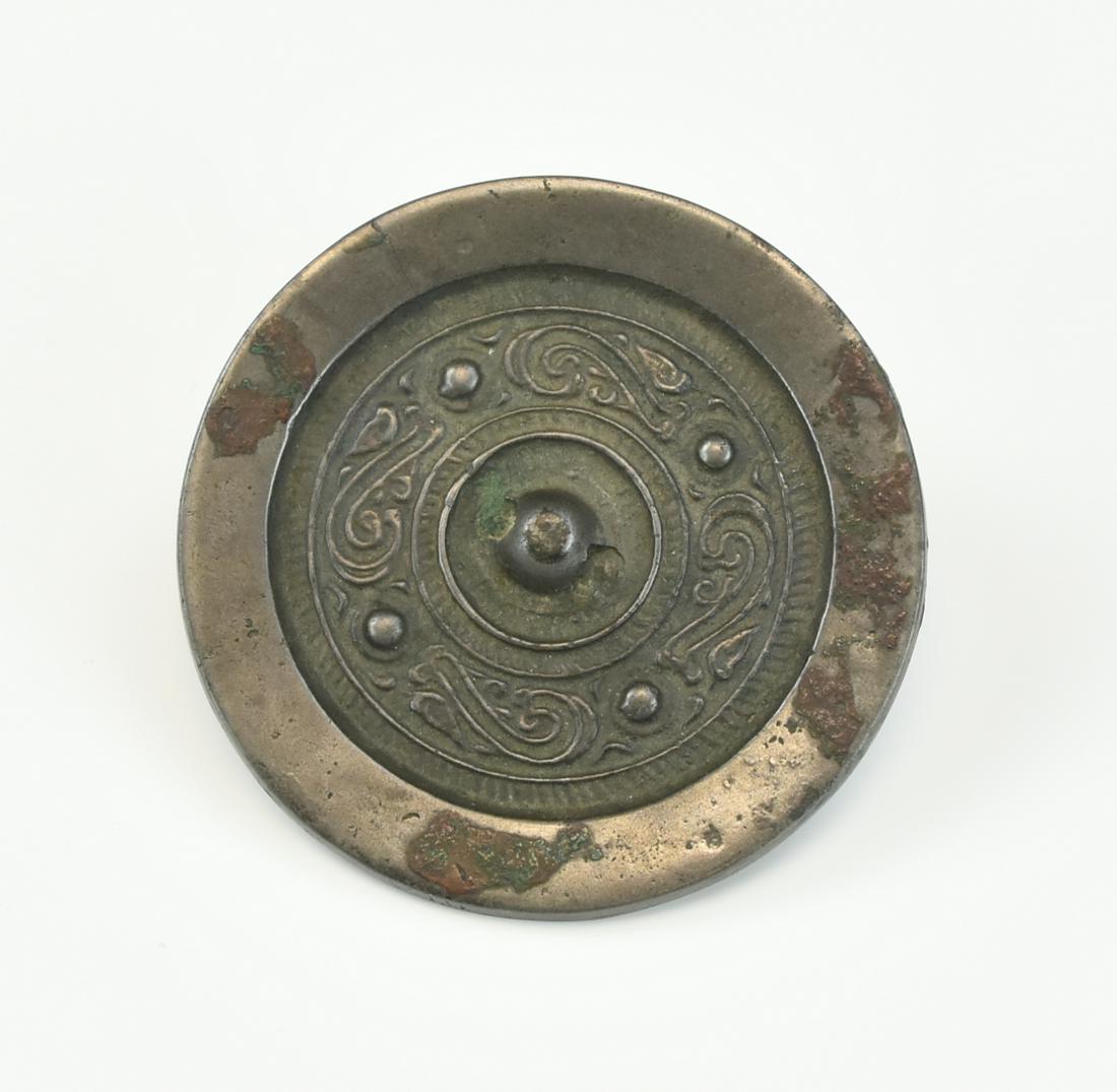 Chinese Bronze Circular Mirror,Han Dynasty: Chinese ,Han Dynasty, circular bronze mirror with a smooth front & patterned, bulleted back, with a central domed attachment loop. D: 3.3"(8.4cm) from a Maryland estate Condition: in good condition wi
