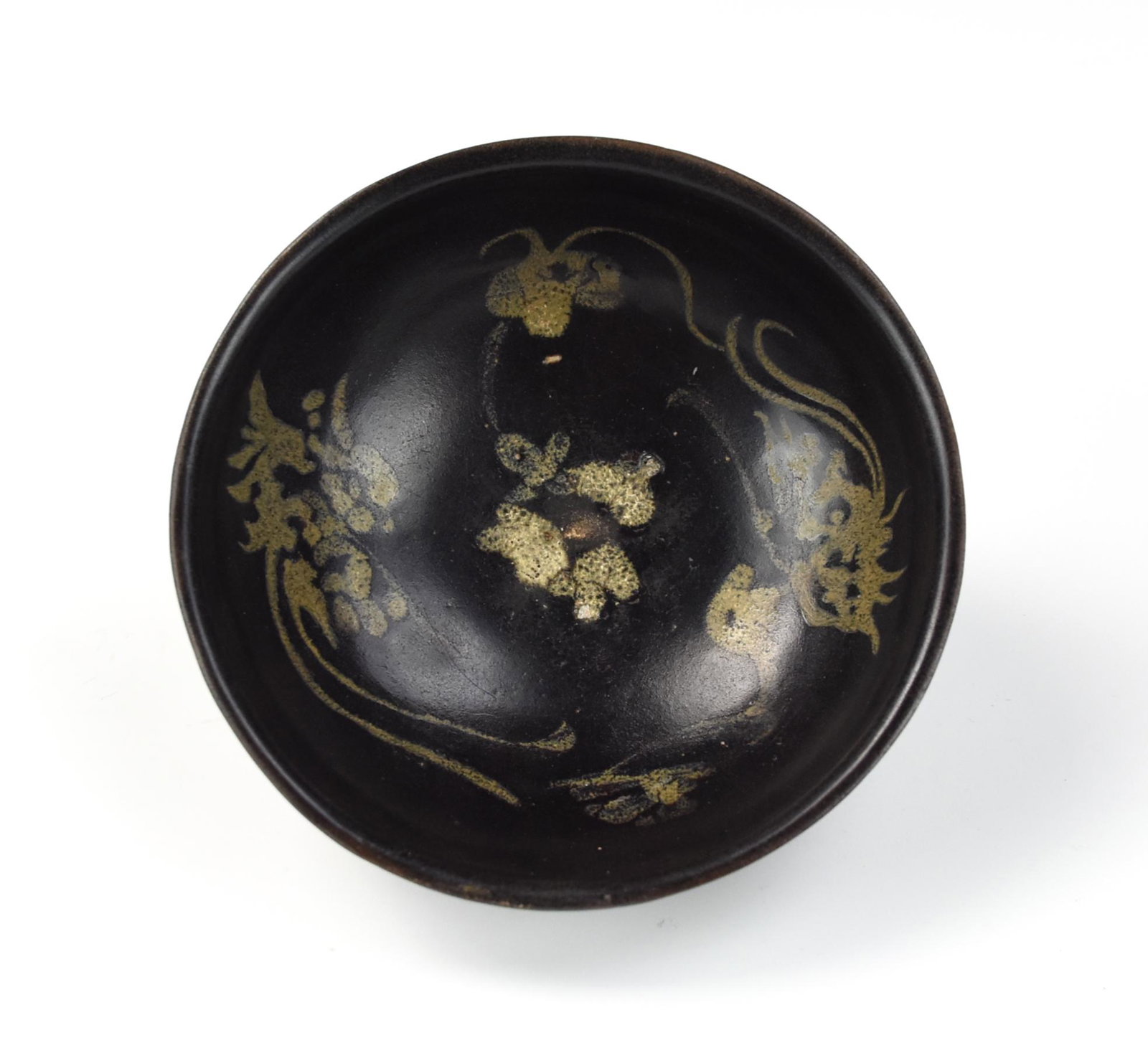 Chinese Jizhou Black Glaze Phoenix Bowl, Song D.: Chinese ,Southern Song D,the interior decorated in papercut resist with three phoenix-shaped floral cartouches in light brown, all reserved against a ground of dark brown glaze, the exterior covered i