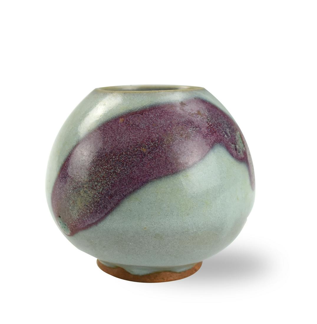 Chinese Jun Ware Water Jar: of globular form, the soft-paste porcelain delicately molded with sky blue layer and a spray of purplish layer, the glaze stopping unevenly H: 3.2"(8.2cm) D: 3.8"(9.7cm) Condition: In overall good con