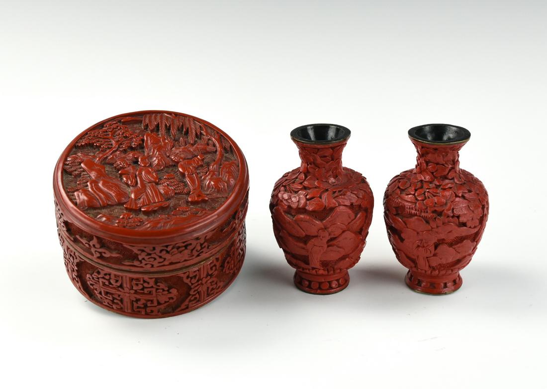 Two Chinese Lacquer Ware Vases and One Box,20th C.: Chinese,20th C, of tall circular shape, the flat cover deeply carved with three figures in a landscape setting, with flowers and scrolls carved around the body including a geometric diaper band, the b