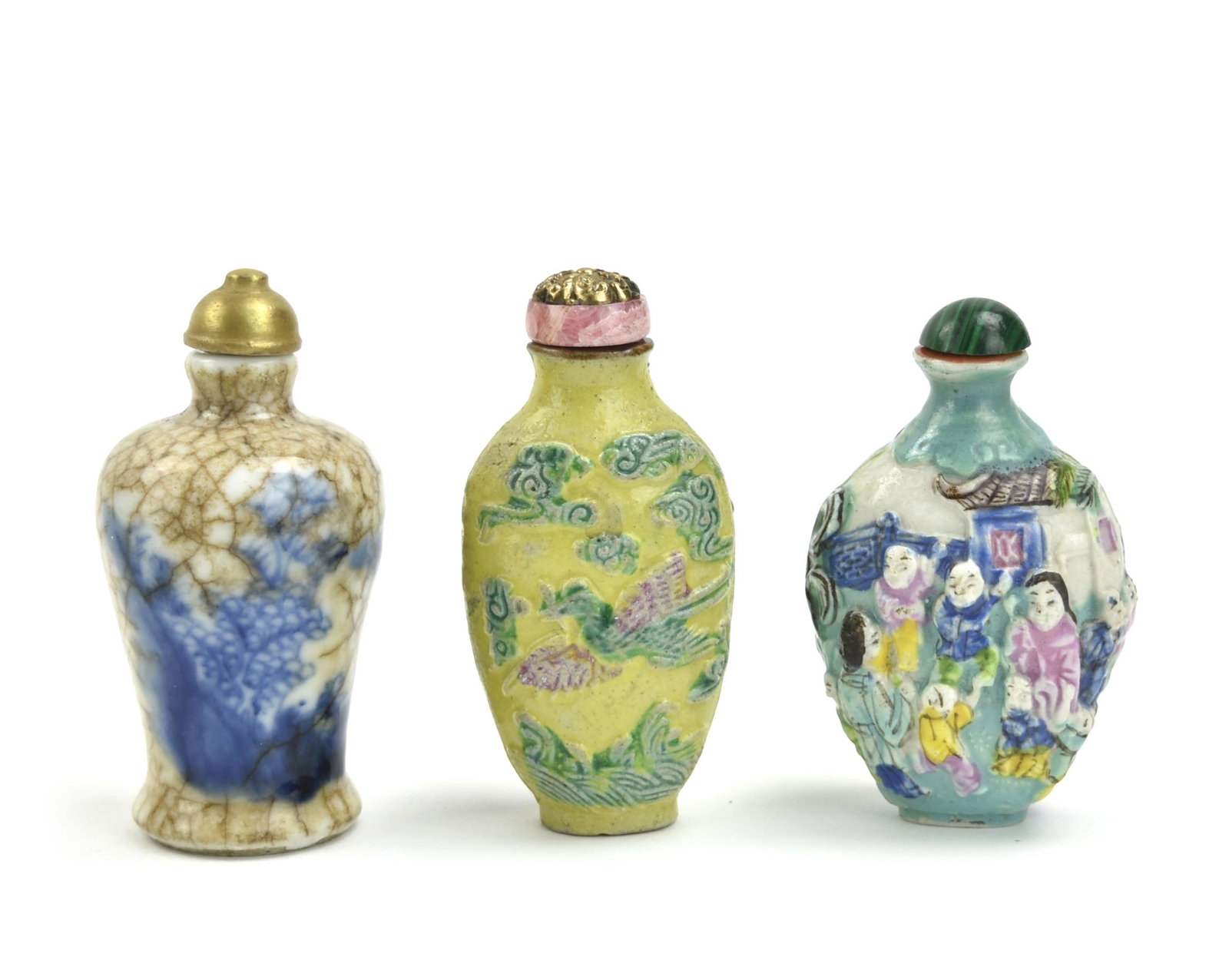 3 Chinese Porcelain Snuff Bottles, Qing D.: 3 Chinese ,Qing Dynasty ,a yellow ground snuff bottle with molded cloud swirls, crashing waves and birds, with a coral colored stopper with a gilded floral motif plated on top. a brown and blue & whit