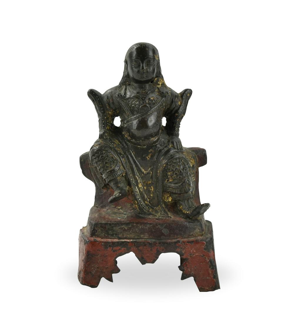Chinese Bronze Buddha of Zhenwu, Ming Dynasty: Chinese, Ming Dynasty, bronze of a meditative ZhenWu / Xuanwu Tati figure seated on a backless throne, with his hands at the thighs and bare feet, his legs are spread apart with one hand remains down 