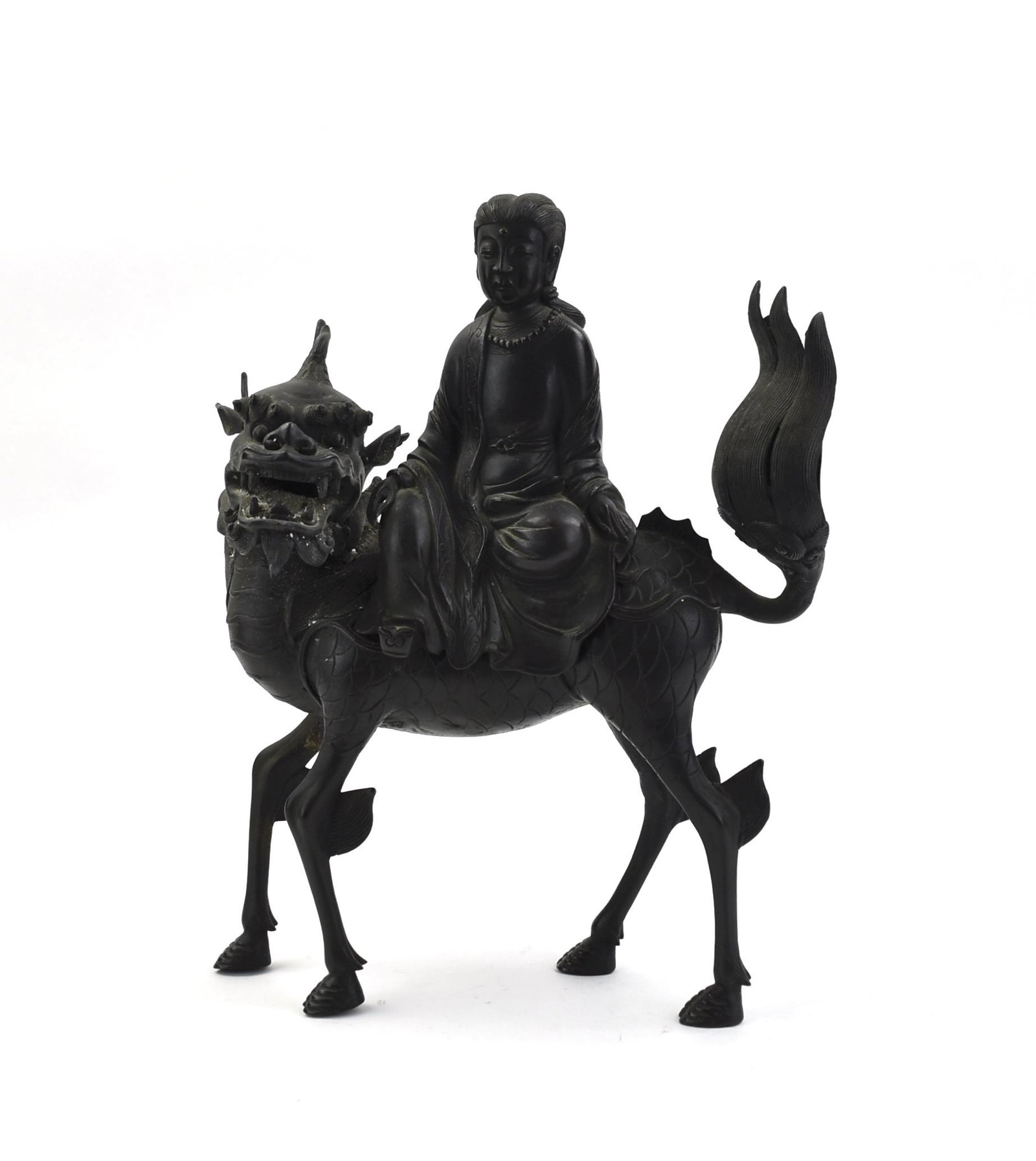Chinese Bronze Guanyin on Qilin, Qing Dynasty: Chinese ,Qing D ,a bronze statue of a guanyin seated on a mythical beast like animal with four legs, guanyin, with a beaded necklace, wearing a long folded robe with one leg crossed with both hands re