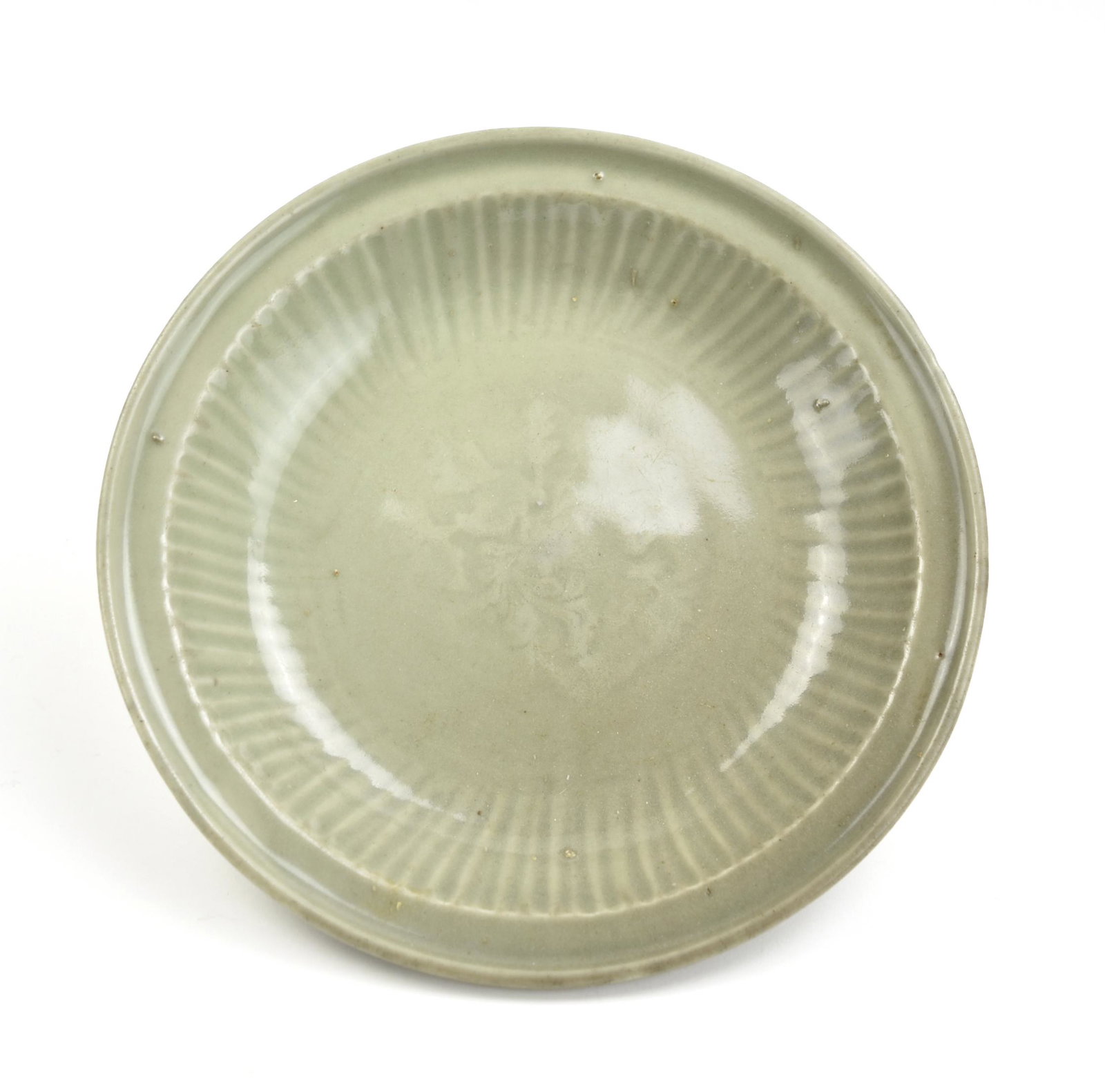 Chinese Longquan Celadon Charger, Ming Dynasty: Chinese,Ming Dynasty, longquan plate from rounded sides rising from a short tapered foot to a broad rim, present under a smooth even finish H: 2.1"(5.4cm) D: 10.9(27.7cm)Condition: In good overall con