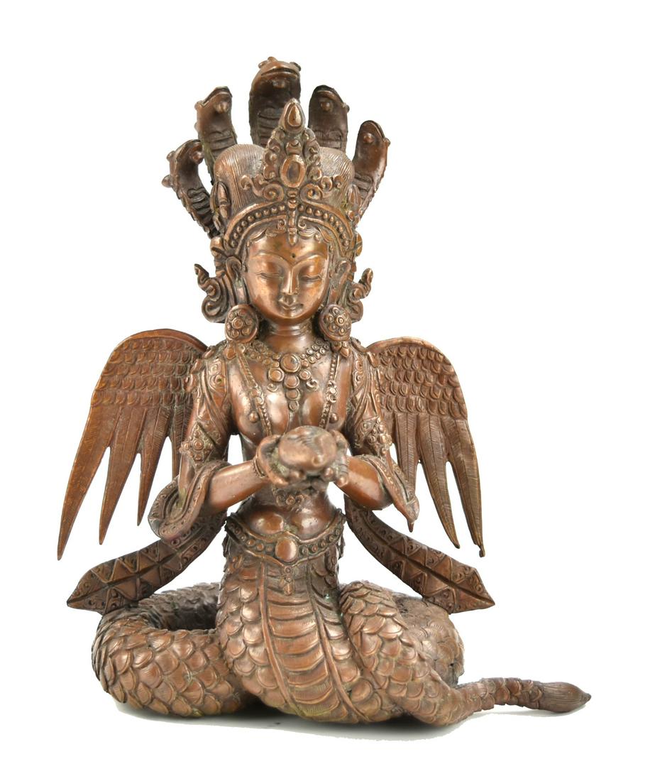 A Thailand Burmese Figure: the figure in a dhoti with body jewelry and crown, revealed upper body in a seated position with her lower body in a dragon tail form, both hands holding a jar, back attached with two wings, and five