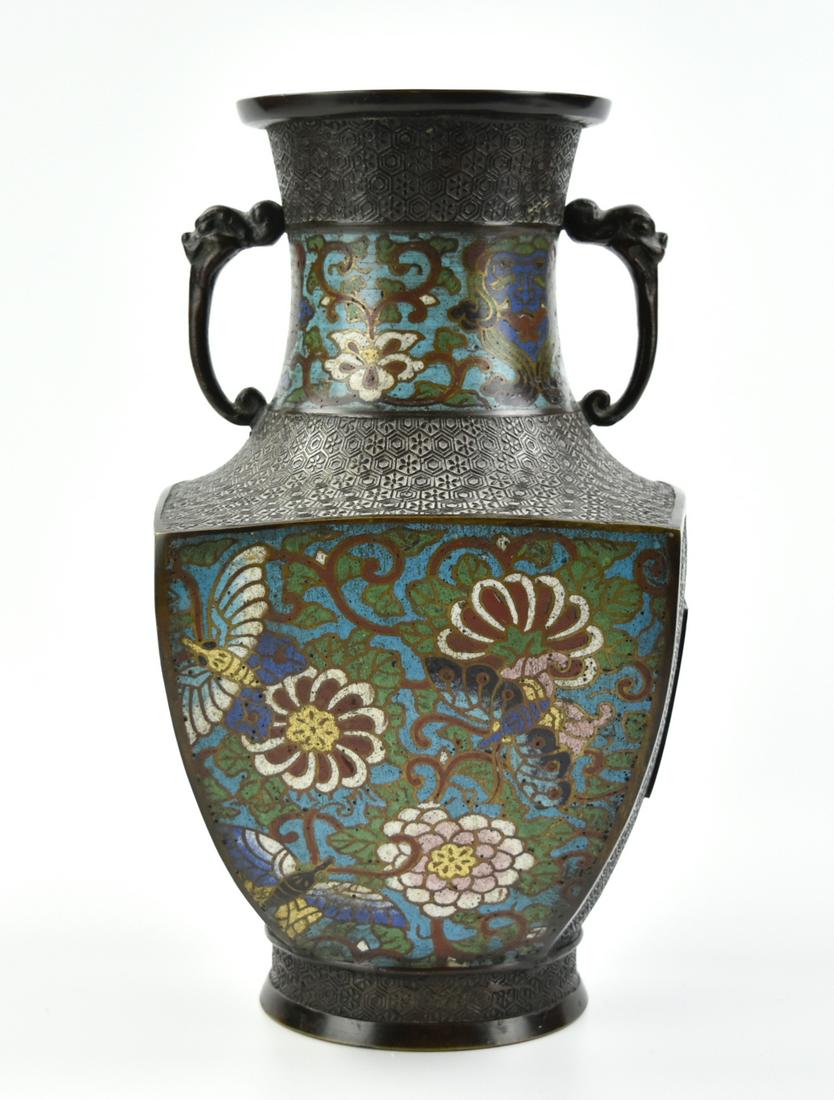 Japanese Cloisonne Square Vase, Meiji Period: a Japanese ,Meiji Period, cloisonne vase, painted with floral motifs and foliage scrolls on a geometric patterned ground, attached with a pair of animal head handle to the neck H: 11.6"(29.5cm) Proven