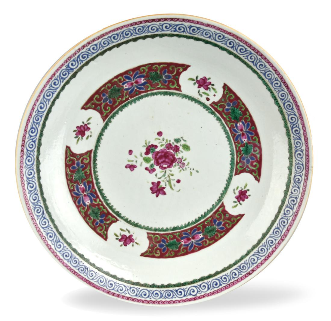 Large Chinese Famille Rose Charger, 18th .: A Chinese,18th C, porcelain, famille rose plate, with barbed & lobed rims decorated with scrolling floral design on pink,blue,green ground, pink flower in the center. D: 14.5" (36.8cm) Provenance: Est