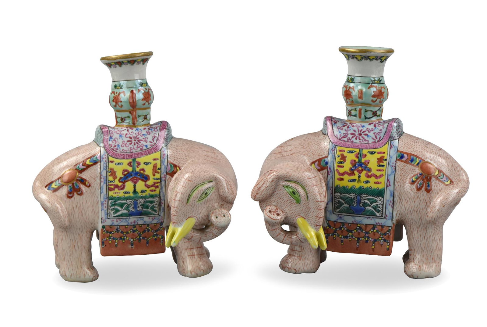 Pair of Chinese Elephant Candlesticks, 19/20th C.: A pair of Chinese ,19/20th C,famille rose elephant candlesticks, each one with head turned so that when together they both face the viewer. Candlestick rises from the saddle of each elephant. H. 7.5" 