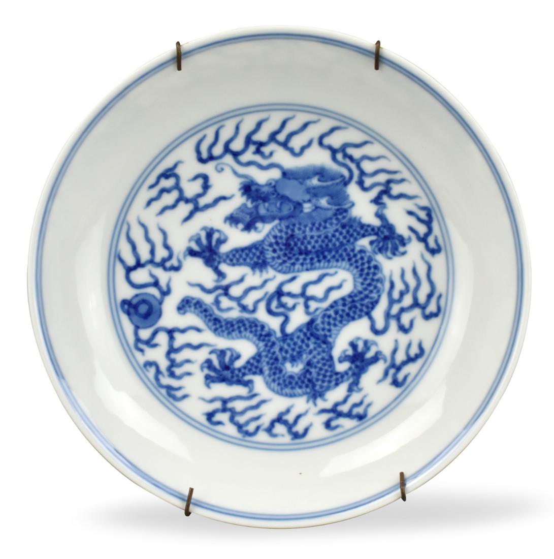 Chinese B & W Dragon Plate, Guangxu Mark: A Chinese blue & white dragon plate, with Guangxu Mark and possible of the period. The dragon design on bottom is surrounded by two blue circles, with another two under the inside edge. Two dragons on