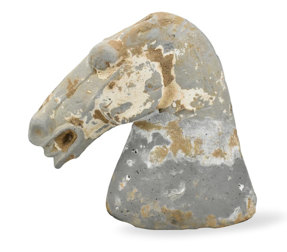 Chinese Stoneware Horse Head, Tang Dynasty: An ancient Chinese stoneware horse head, dating from the Tang dynasty (618-906). Narrow head that has detail on both sides. The head can stand on its own. Realistic mouth, teeth, nostrils, and head mu