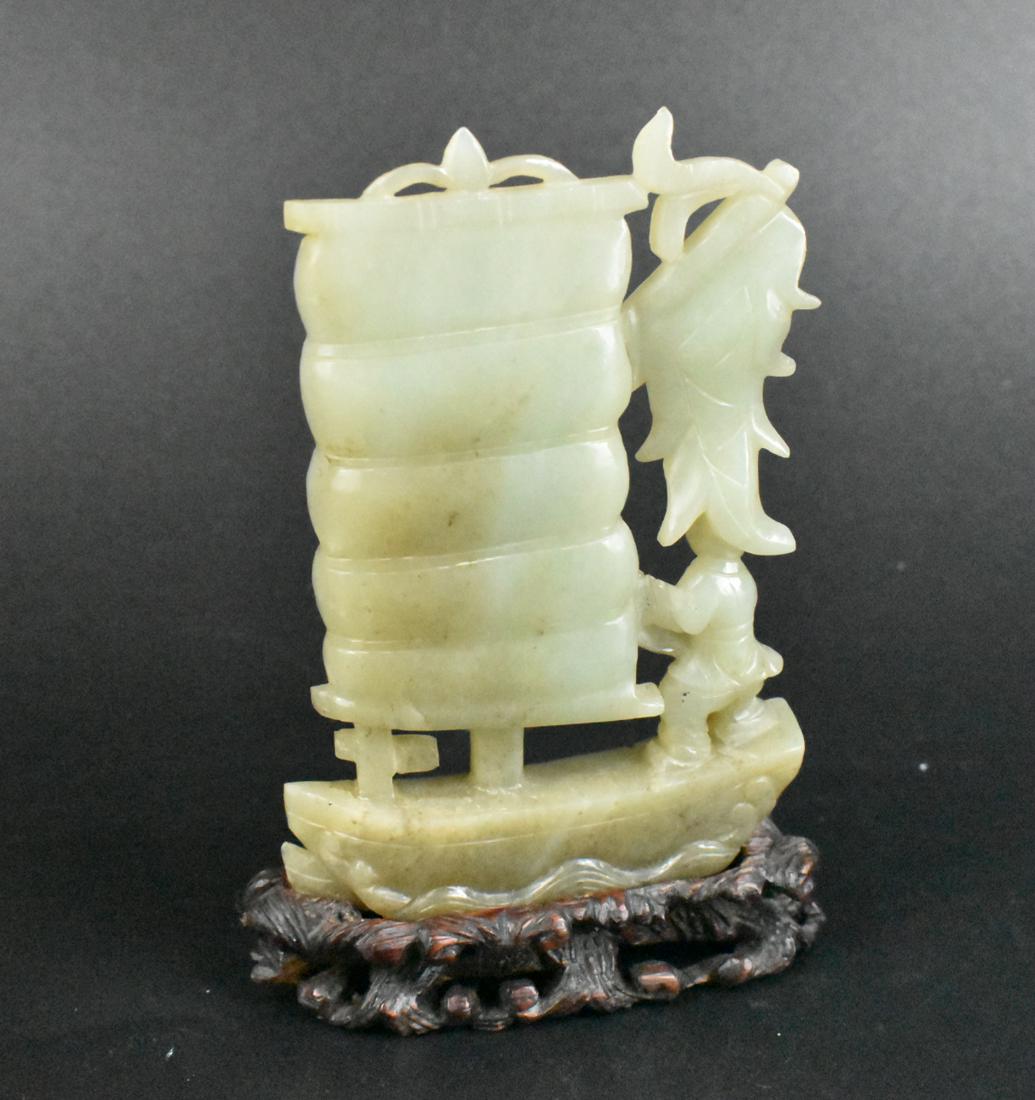 Chinese Jade Carved Sailing Boat & Stand, Qing D.: A Chinese jade carving of a sailing boat. A Chinese style sailing boat with masts and sail being controlled by a standing carved jade figure holding to ropes attached to the sail. On a boat with wave 