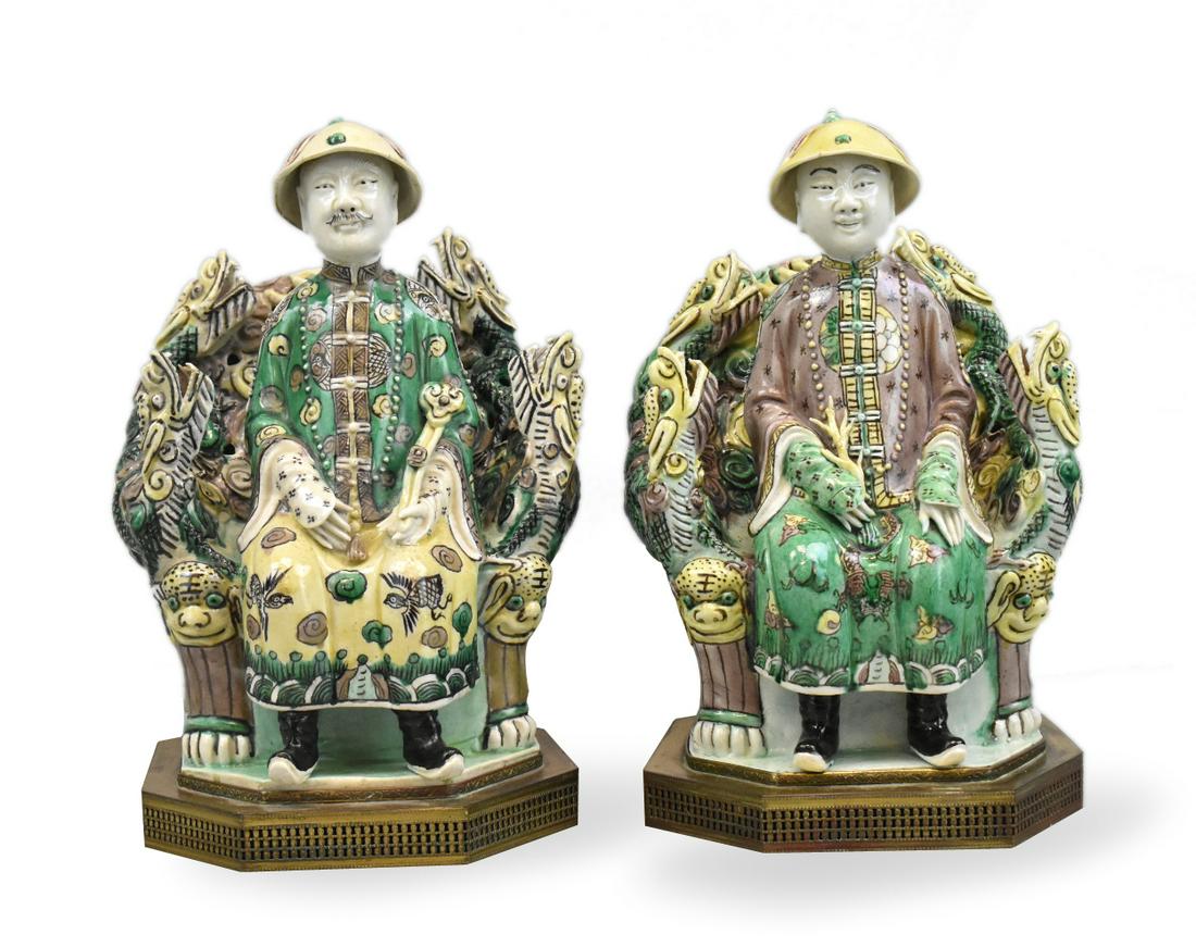 Pair Chinese Sancai Glazed Emperor Figures,19th C.: pair of Chinese sancai glazed porcelain figures,19th C, of emperor in a domed hat, with loose robe and long beaded necklace, with flames or roots and scepter issuing from one hand, seated on an openwo