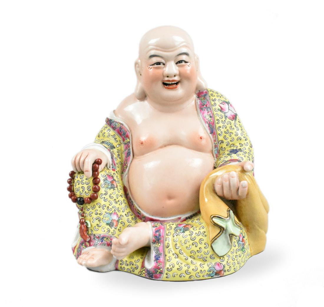 Chinese Famille Rose Buddha Statue, Zeng Rongsheng: A famille rose Buddha statue,attributed to " Zeng Rongsheng." Rectangular incised stamp on the base. The Buddha sits with one know up in very colorful yellow, red, green famille rose robe that's open.