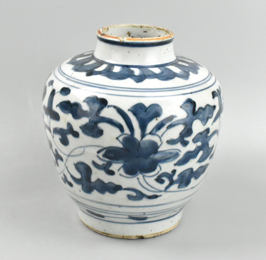Chinese Blue & White Floaral Jar, Ming Dynasty: A Chinese blue & white jar dating from the Ming dynasty (1368-1644). Jar has several bands around the foot ares, the shoulder, the neck, and rim, and a blue glaze design of lower shapes linked by vine