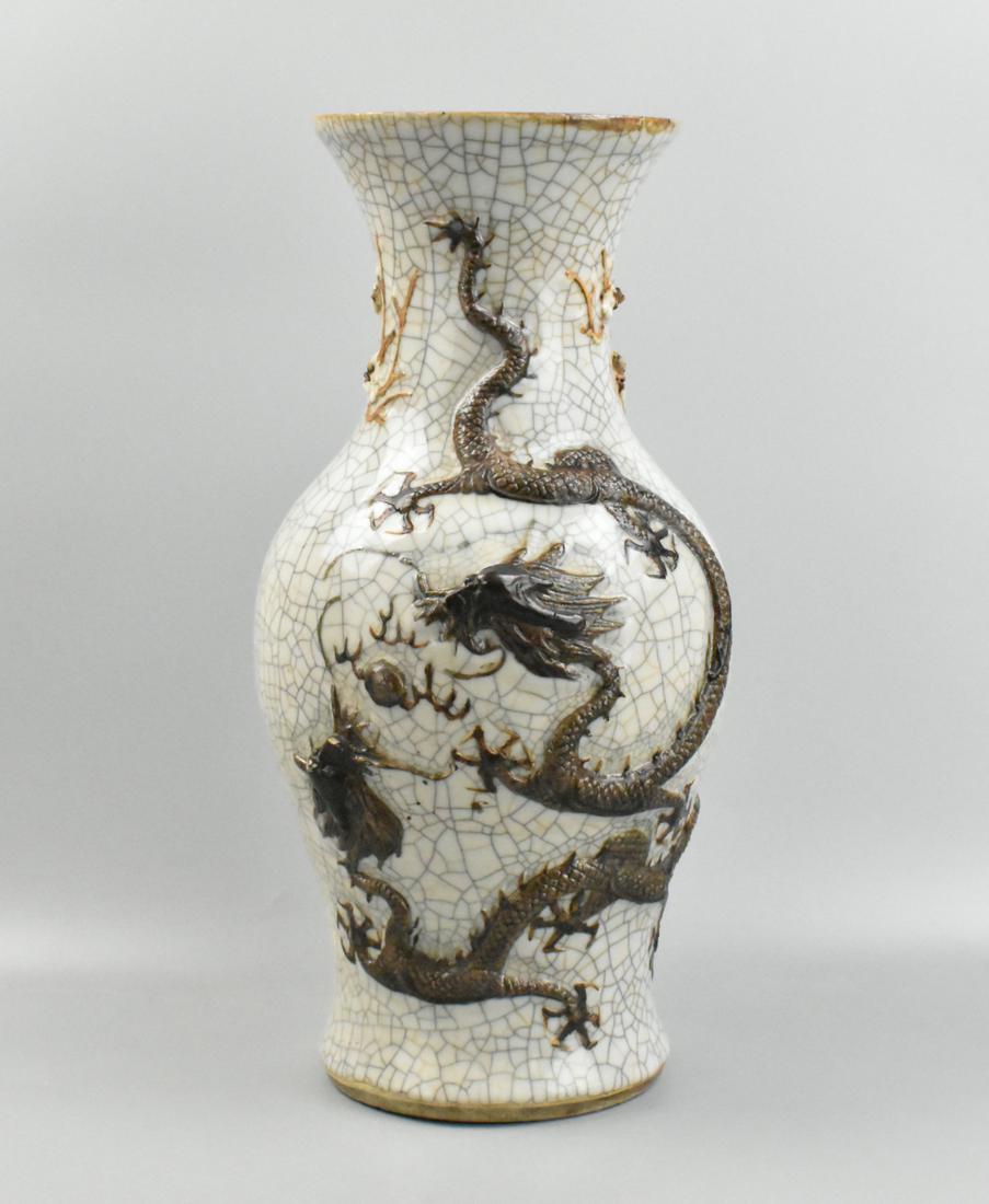 Large Chinese Ge Glazed Twin Dragon Vase,19th C.: A Chinese ge glazed twin dragon vase, dating from the 19th century. A wide base on the heavily potted vase with thick neck and wide mouth, featuring two raised dragons amongst clouts on one side and s