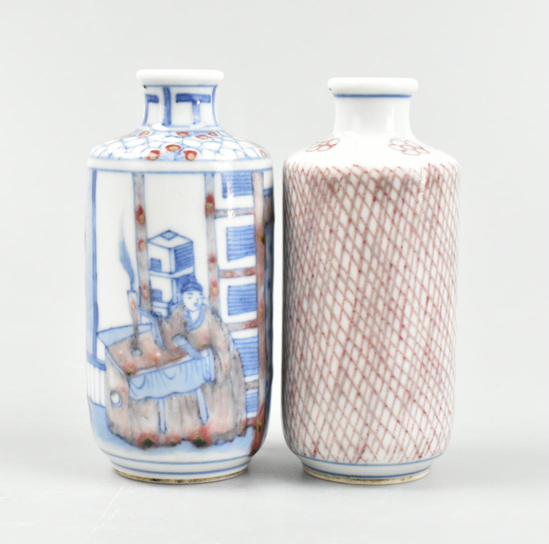 2 Chinese Blue & Copper Red Snuff Bottles, 19th C.: Two Chinese blue and copper red snuff bottles, dating from the 19th century. Each bottle a similar rouleau shape vase style, one slightly larger. Larger has design of figures in an interior with a bal