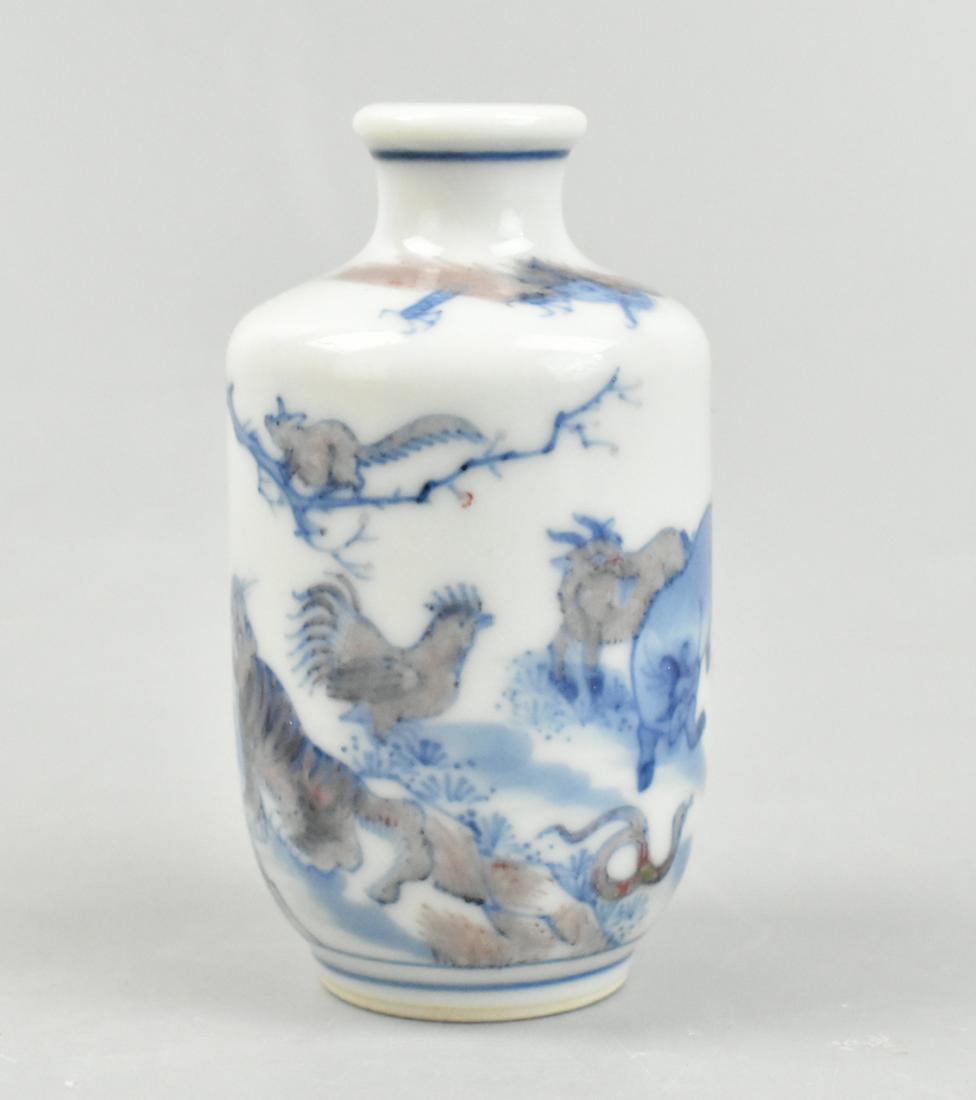 Chinese Blue & Copper Red Snuff Bottle w/12 Zodiac: A Chinese blue & copper red snuff bottle with the 12 Zodiac symbols. Within a blue circle band under the rim and above the foot are the 12 animal zodiac figures, among them the ox, rabbit, rooster, ti