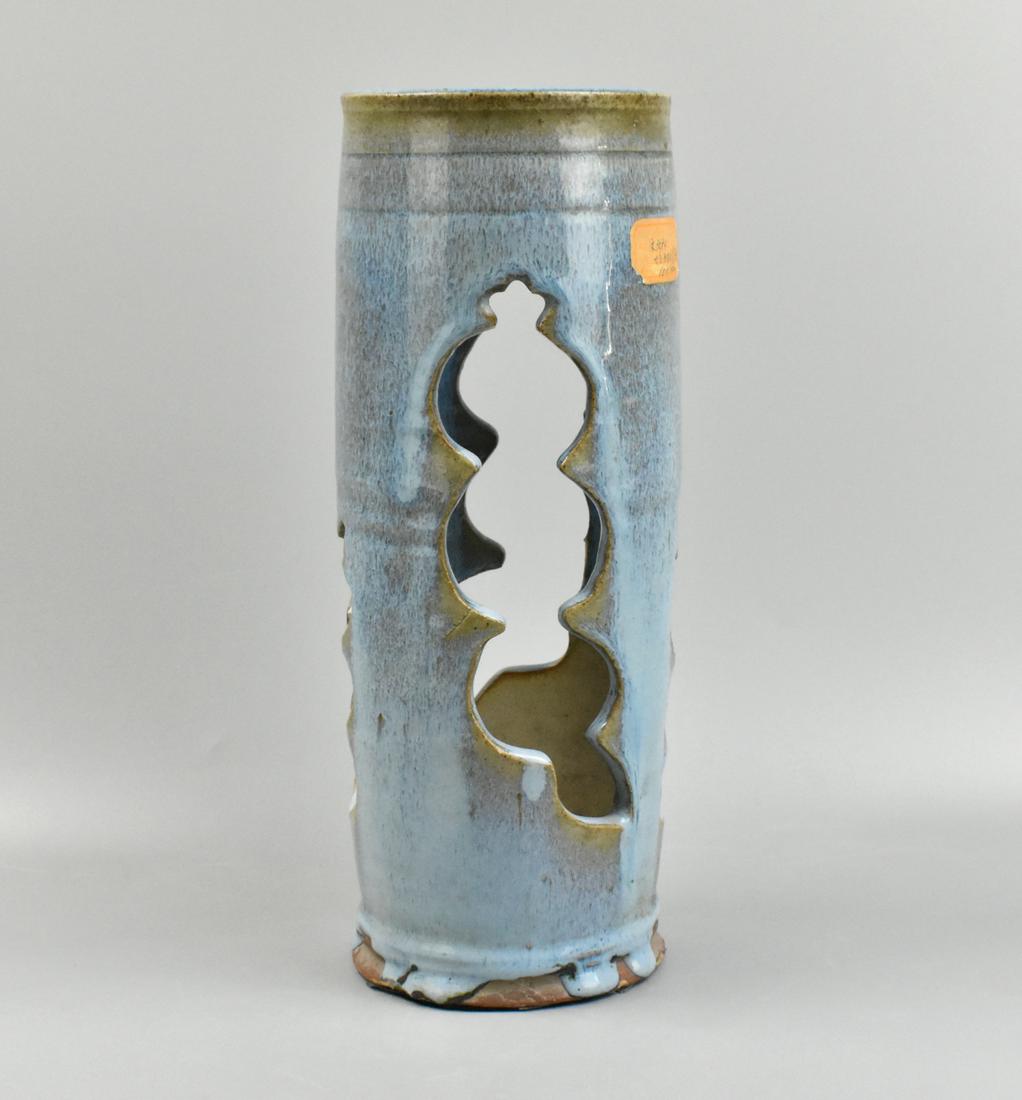 Chinese Jun Glazed Hat Stand, Qing Dynasty: A Chinese Jun glazed hat stand, dating from the Qing dynasty. The tall hat stand in jun glaze has four dramatically shaped openings around the cylinder shape. Two incised bands around the top beneath 