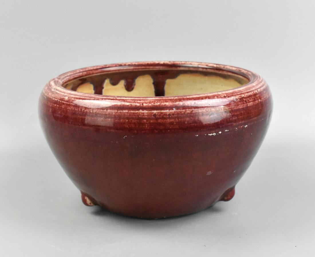 Chinese Flambe Glazed Washer, 19th C.: A Chinese flambe glazed large washer, dating from the 19th century. Three small faux rounded tripod feet are raised near the base. Flambe thinly applied around the rounded form, with dripping at rando