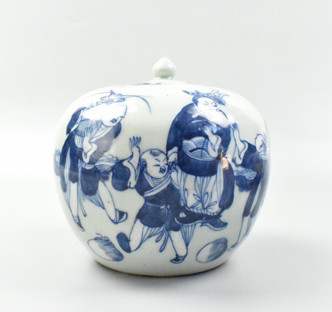 Chinese Celadon Blue & White Covered Jar ,19th C.: A Chinese Celadon blue and white covered jar, dating from the 19th century. A rounded form with flat top and recessed cover and a pointed finial. The design features different ages Chinese figures, on