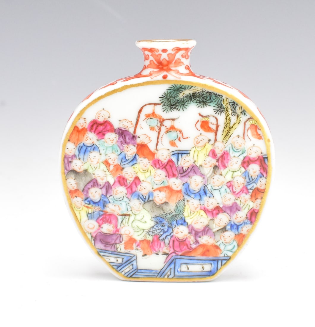 Chinese Famille Rose Snuff Bottle w/ Boys: A Chinese famille rose snuff bottle with boys. A small rectangular base with two narrow sides. Wide heart shaped front and back with multiple tiny boy congregated with trees in the background. A small