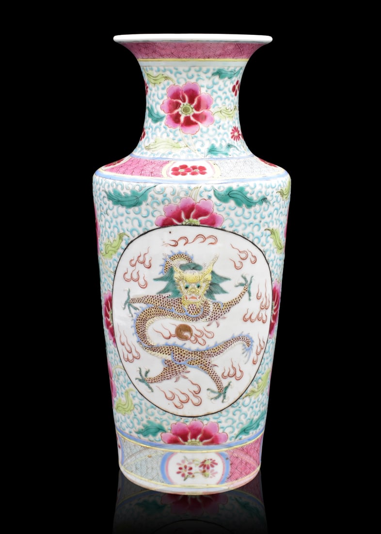 Chinese Famille Rose Dragon Rouleau Vase, 19th C.: A Chinese famille rose dragon rouleau vase, dating from the 19th century. Vase with bright pink, blue, and yellow featuring two round panels with dragons amongst clouds with a pearl. Surrounded by blu