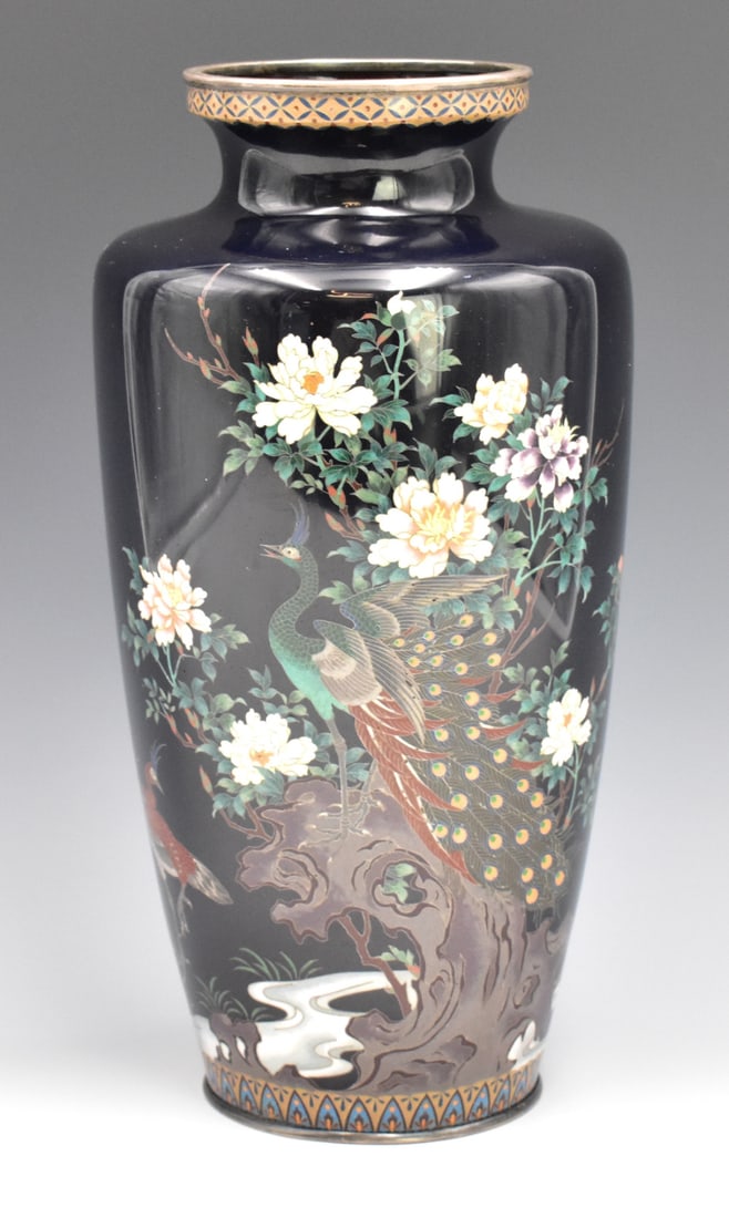 Japanese Cloisonne Peacock Vase, Meiji Period: A Japanese cloisonne peacock vase, dating from the Meiji period. A high shouldered vase which expands from base to a high shoulder and angular taper to neck and flared mouth. Colorful detailed peacock