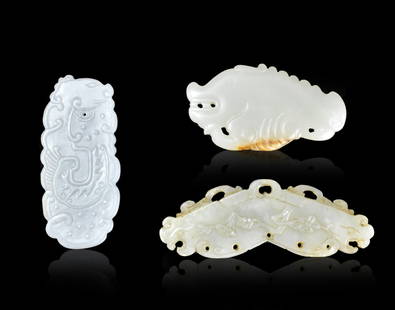 3 Chinese Jade Carved Plaques, Qing Dynasty: Three Chinese Jade carved plaques,all from the Qing dynasty period. The longest in a bat shape with a beast head at either side, lightly incised flowers and peach branch on both sides and a loop hole