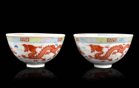 Pair of Chinese Famille Rose Dragon Bowls, ROC Pe: pair of Chinese famille rose dragon bowl, dated from Republic Period, decorated with pair of iron red dragon in pursuit of a flaming pearl ,an iron red roundel dragon design in the center, the rim bor