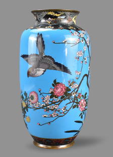 Japanese Cloisonne Vase, Meiji Period: A Chinese cloisonne vase, dating from the Meiji period (1868-1912). A tall rounded body gently expanding from the base then tapering at a high shoulder to a short flared mouth. Japanese flowers and tr