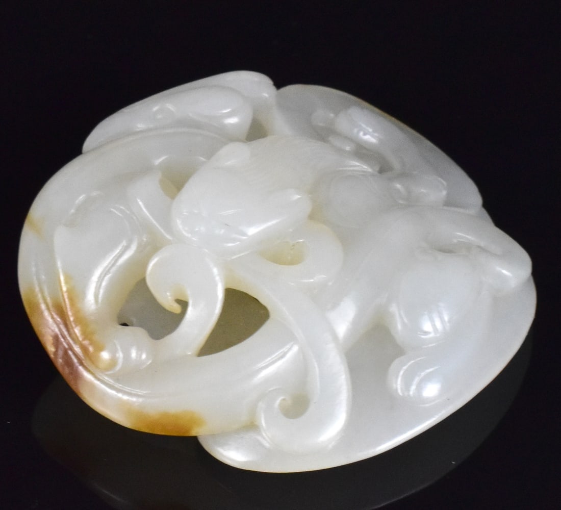 Chinese White Jade Carved Dragon Pendant,18th C.: Chinese white jade carved dragon pendant, dated from 18th C. top carved with a swirling Chi dragon holding its tail in the mouth, bottom carved in "She" shaped with pointed tip D: 1 7/8"(4.8 cm) Prove