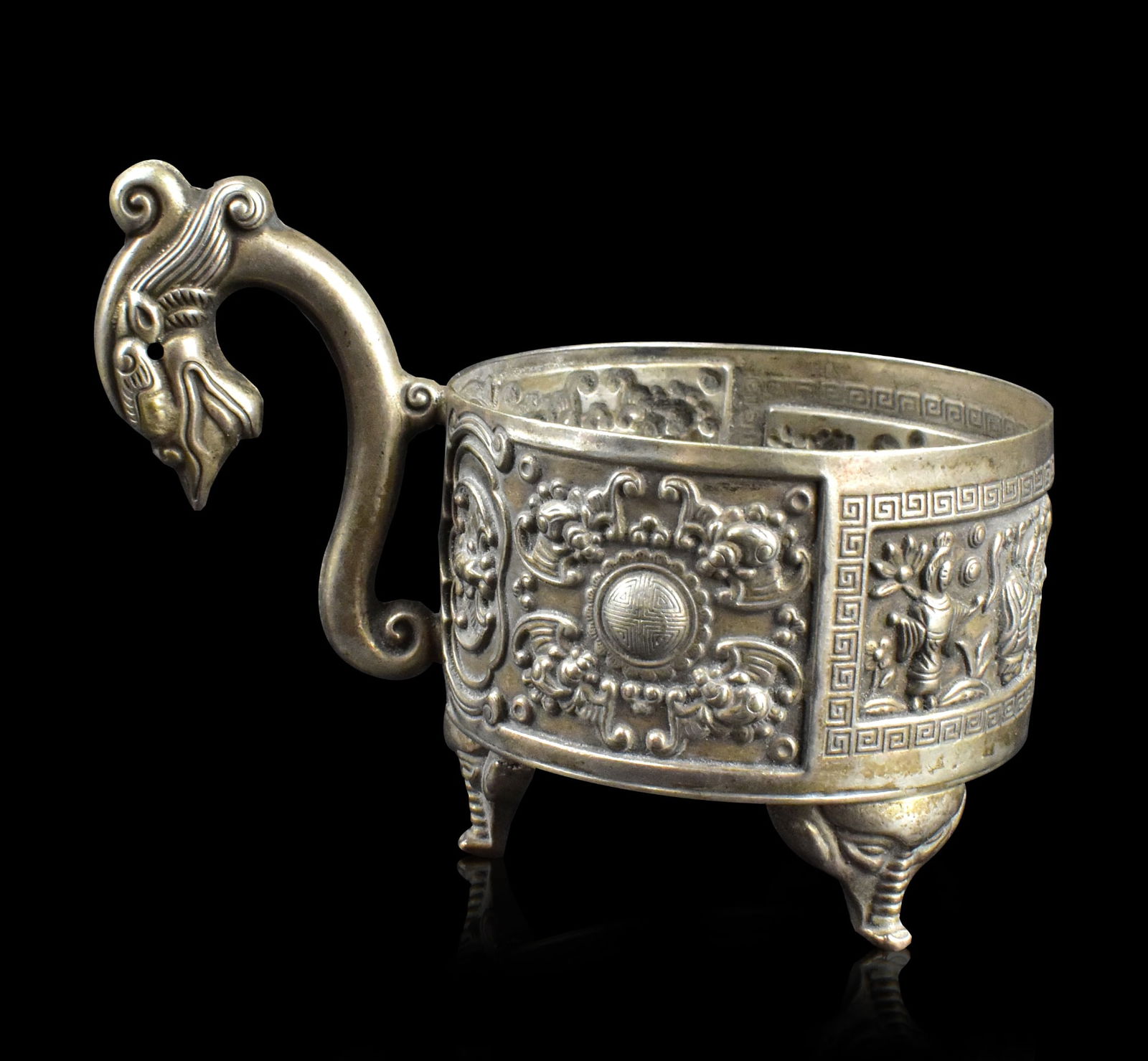 Chinese Export Silver Dragon Handle Cup,ROC Period: Chinese export silver dragon handle cup, dating from Republic Period, Round cup with straight sides and curved dragon style handle. Set over three archaic style elephant legs, incised with Bat & Shou