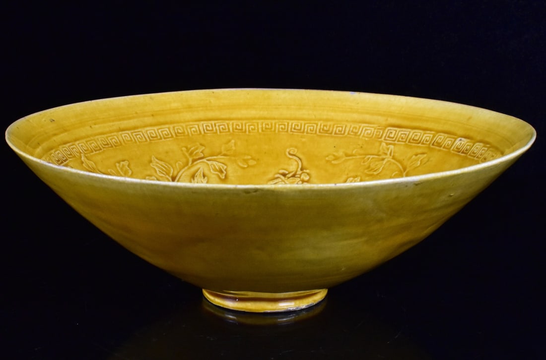 Chinese Egg Shell Yellow Glazed Dragon Bowl,19th C: A Chinese egg shell yellow glazed dragon bowl, dating from the 19th century. Of conical shape, center molded with four characters mark, surrounded by three dragons and scrolling flower design. Thinly