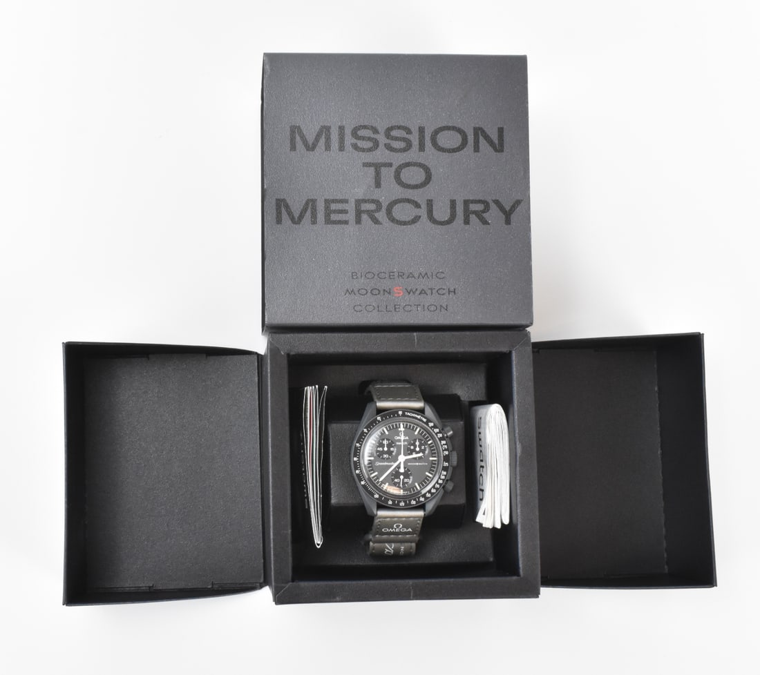 Mission to Mercury Bioceramic MoonSwatch: A Mission to Mercury Bioceramic MoonSwatch, with Omega. On front: Omega Swatch Speedmaster MoonSwatch. With original box and paperwork; paper: 23.3.05, #S033A100, with stamp. Link to HD Natural Light