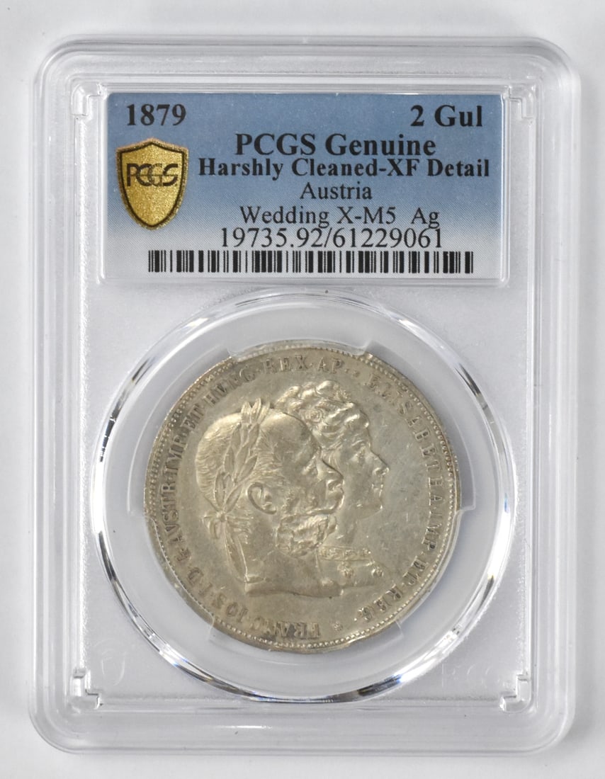 1879 Austrian 2 Gulden 25 Yr Wedding Silver Coin: An 1879 2 Gulden silver coin Franz Joseph 1 and Empress Elizabeth. 25 year wedding anniversary (Sliver Wedding Jubilee). 24.70 g., 36 mm. Silver (.900) Condition: XF Detail, Harshly Cleaned. PCGS grad
