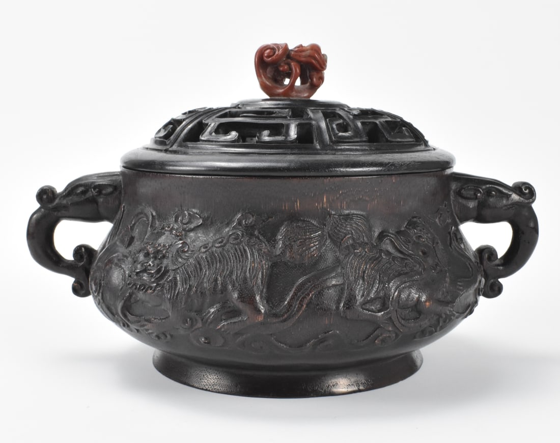 Chinese Bamboo Carved Covered Censer w/ Foo Lion: A Chinese bamboo carved covered censer. compressed censer deeply carved foo lions playing around body, two beast loop handles and deeply incised cover with Chinese archaic pattern with carved agate fi