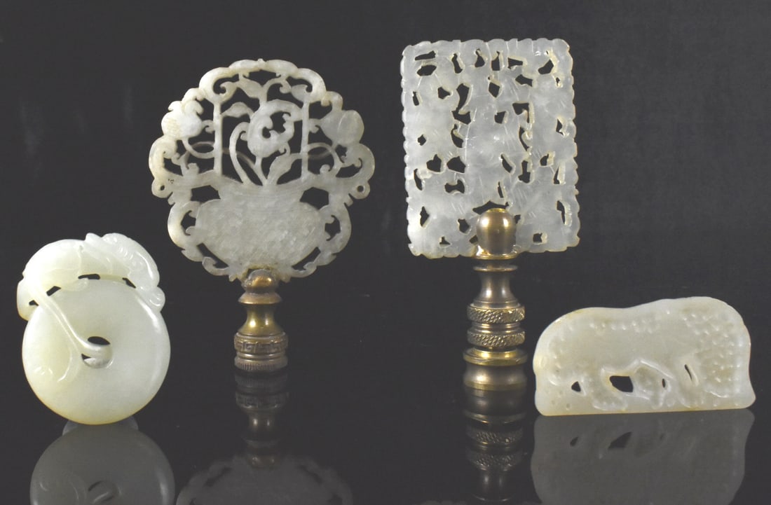 Group of 4 Chinese Jade Carved Plaque,Qing Dynasty: A group of four Chinese Jade carved plaques, dating from the Qing dynasty. Two are finials from lamp, one rectangular and has openwork of multiple boys on both sides, the other rounded with openwork o