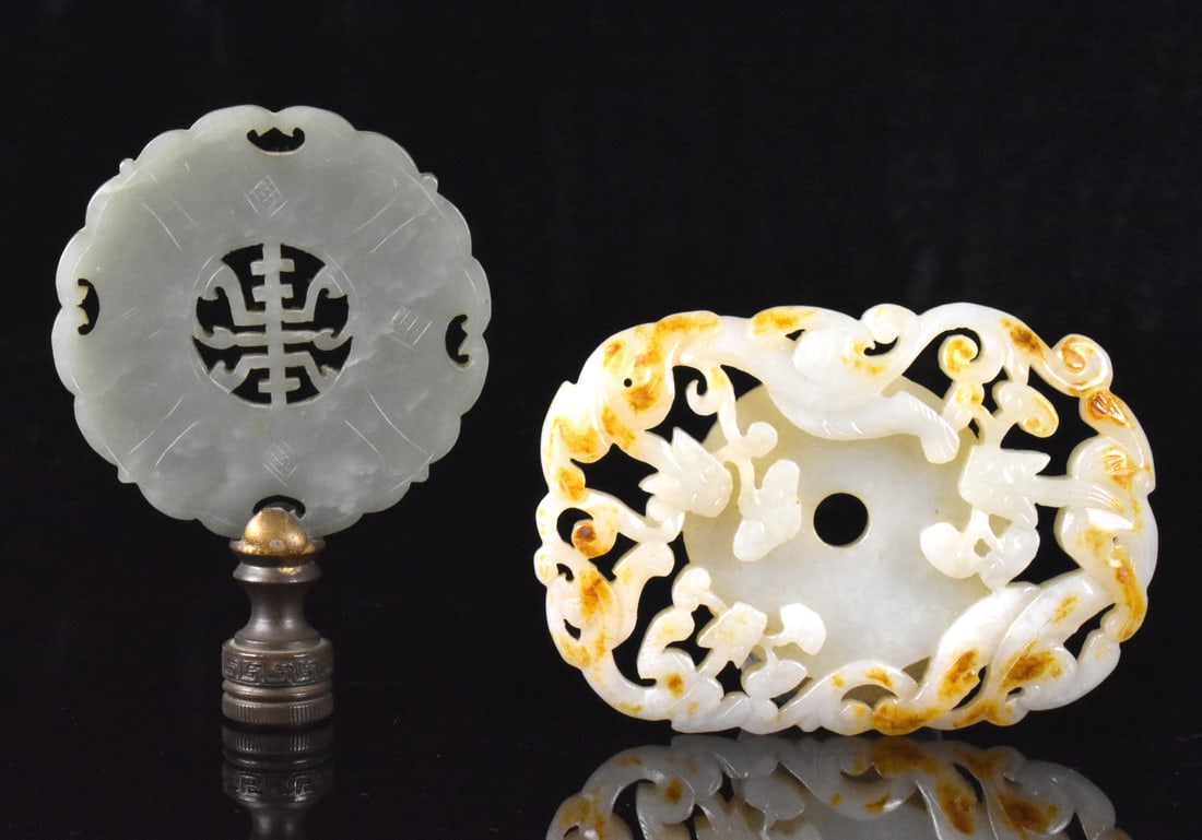 2 Chinese Jade Carved Plaques, Qing Dynasty: Two Chinese jade carved plaques, dating from the Qing dynasty. One white jade with butterscotch inclusions carved with 3 dragons holding Lingzhi mushroom in their mouth in a rectangular design with a 