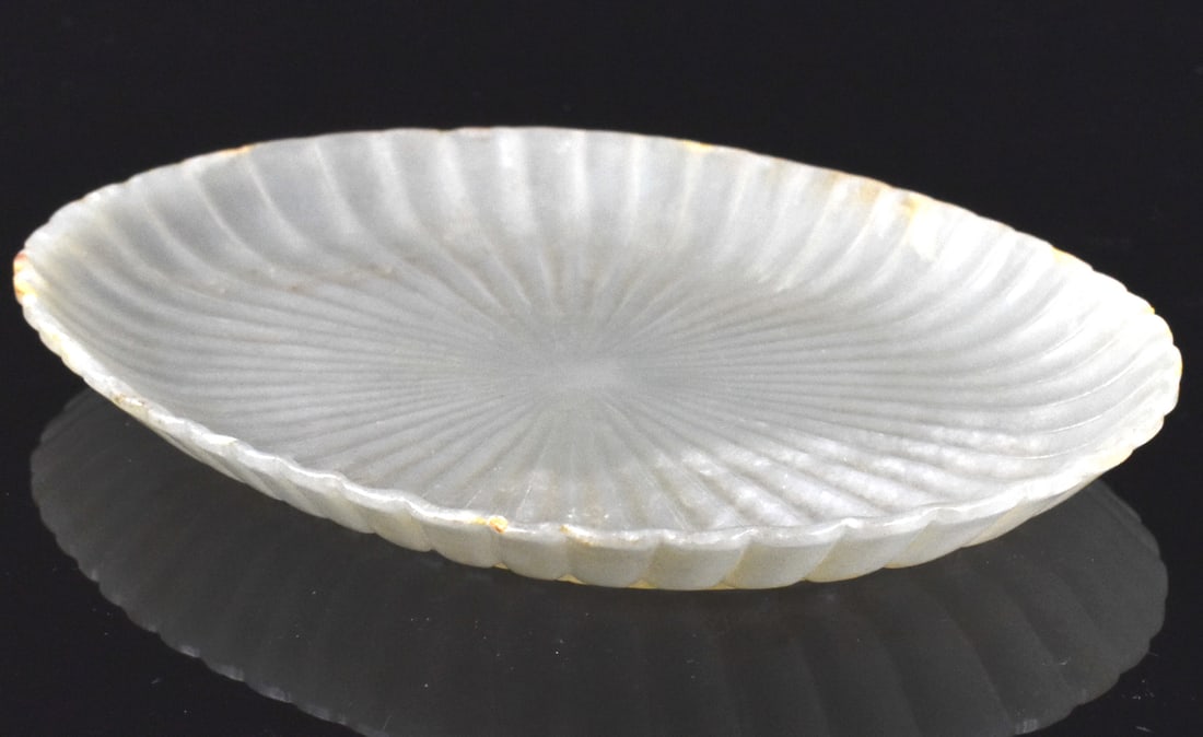 Chinese Muhgal Style Carved Jade Dish,Qing Dynasty: A Chinese Mughal style carved jade dish, dating from the Qing Dynasty, A shallow precisely carved dish with ridged chrysanthemum petal design fanning out from center to the edges. Underside also carve