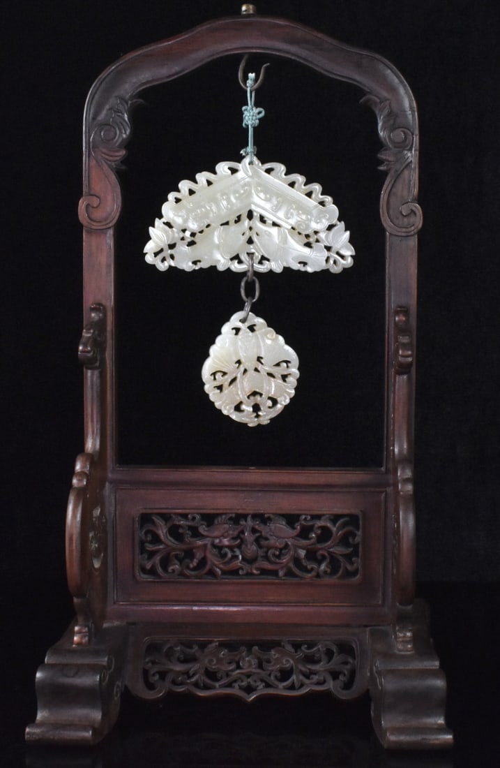 2 Chinese Jade Carved Plaque on Stand: 2 Chinese jade carved plaque on stand, hanging on a wooden carved stand is two piece plaque ,both reticulated with openwork, one design with twin fish below a Chinese "Qing", other one design with a b