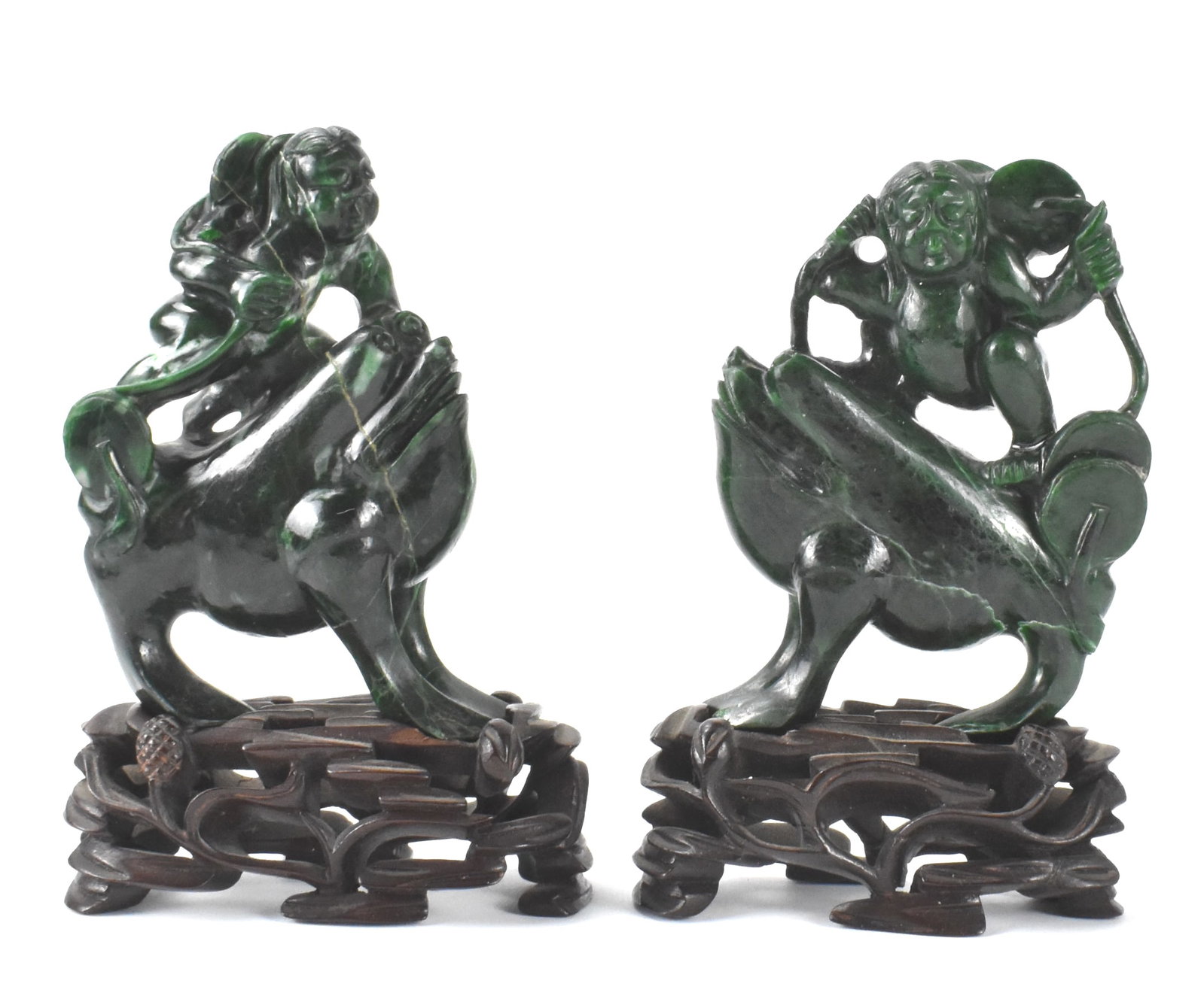 Pair Chinese Spinach Jade Carved Liuhai &Stand,ROC: A pair of Chinese spinach jade carved Liuhai on wooden stands,dated from ROC Period, Two Liuhai on top of large toads holding their coins, carved in dark spinach jade with lighter inclusions. come wit
