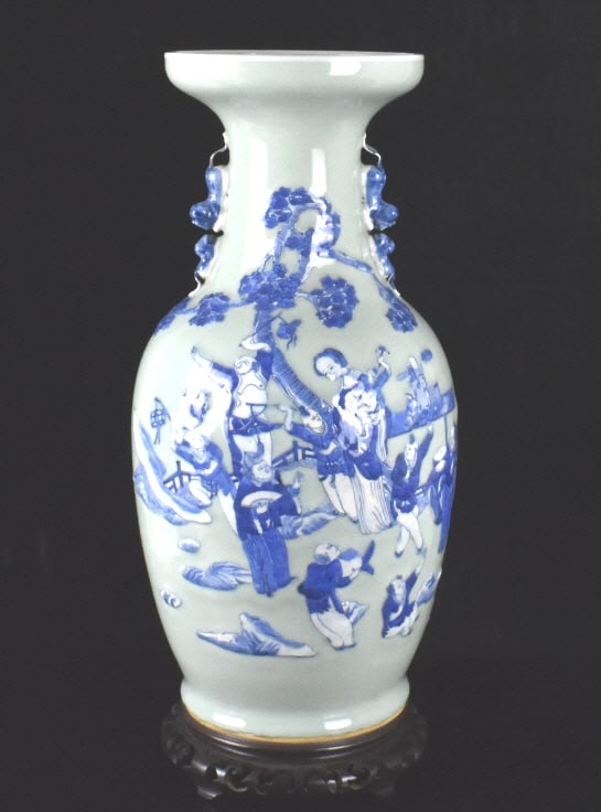 Large Chinese Celadon B & W Figural Vase,19th C.: A large Chinese celadon blue and white figural vase, dating from the 19th century. A festive scene with raised figures on the celadon ground of a happy musical party with men, a woman and a boy. Many 