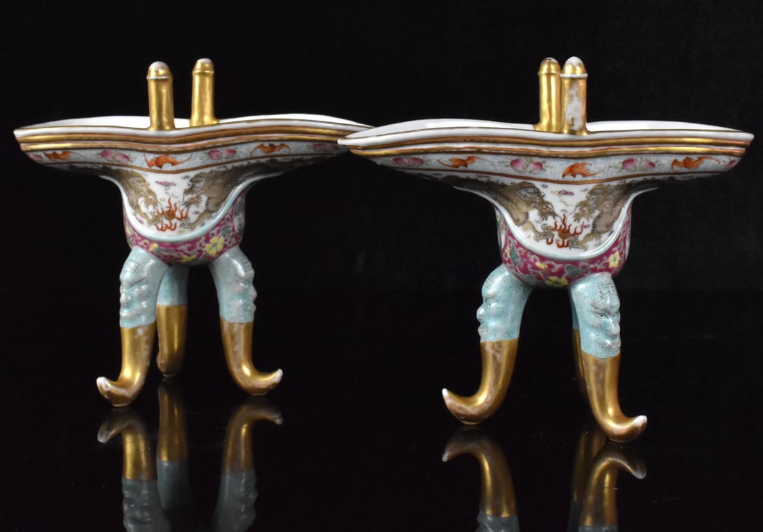 Pair Chinese Famille Rose Dragon Jue Cups, 19th C.: A pair of Chinese famille rose dragon Jue cups, dating from the 19th century. In the basic form of the original archaic bronze cups, The tripod legs have beast mask and curled feet. pair of gilt iron 